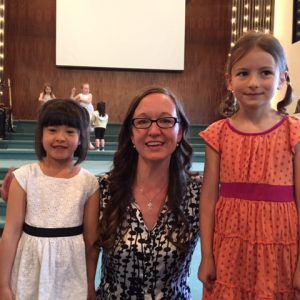 Moonbeam students Ella Stroet and Mariam Carter with MYC teacher Hannah Hamm at their June Recital.